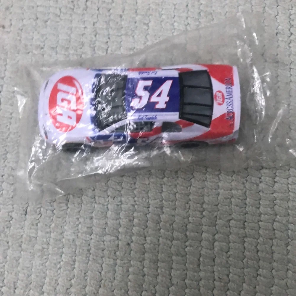 NASCAR die cast toy Monte Carlo Jason Keller #54 car featuring IGA logo. Vintage